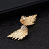 Zlaté náušnice v tvare krídla s kryštálom